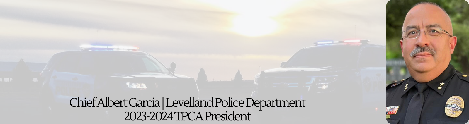 Chief Albert Garcia with 2 patrol cars in the sunset