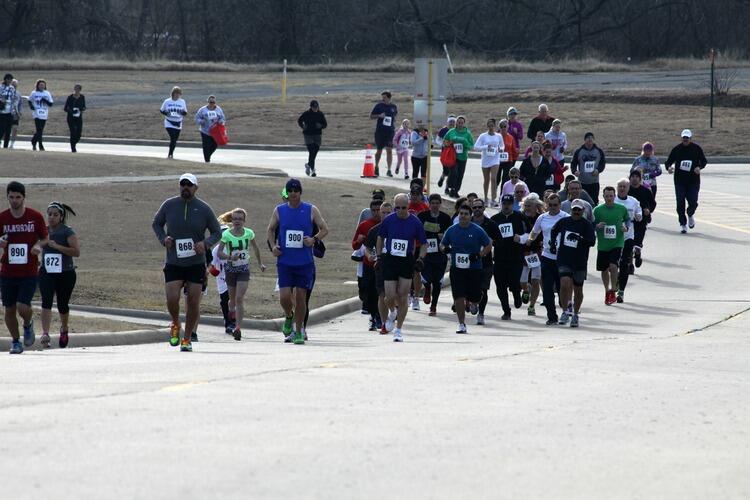 A group of individuals running in a marathon.